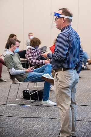 Professor Stratford teaching his humanities class wearing his face shield during Covid-19.