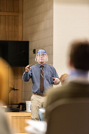 Professor Stratford teaching his humanities class wearing his face shield during Covid-19.