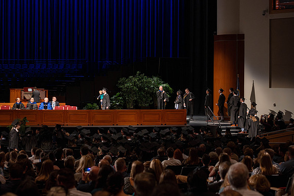 Students graduate from the college of Business and Communication in the I-Center.
