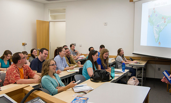 Brother Yost's history class laughs at a joke told in class.