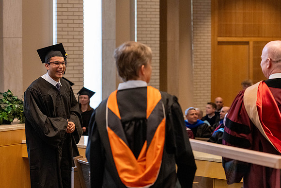 Students graduate from the College of Language and Letters, in the Taylor Building.