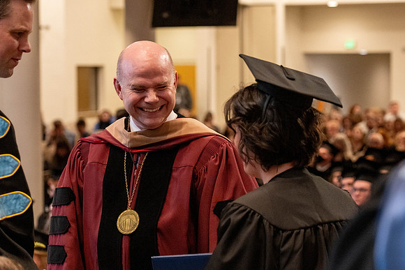Students graduate from the College of Language and Letters, in the Taylor Building.