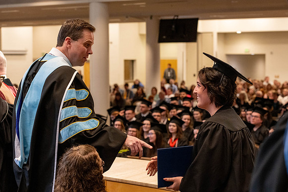 Students graduate from the College of Language and Letters, in the Taylor Building.