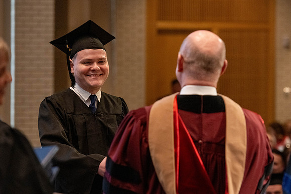 Students graduate from the College of Language and Letters, in the Taylor Building.