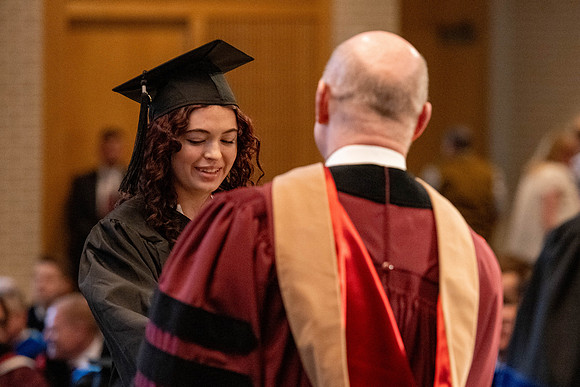 Students graduate from the College of Language and Letters, in the Taylor Building.