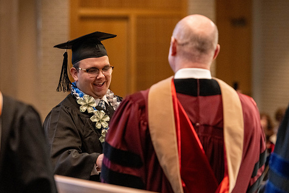 Students graduate from the College of Language and Letters, in the Taylor Building.
