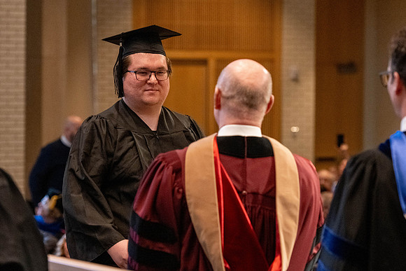 Students graduate from the College of Language and Letters, in the Taylor Building.