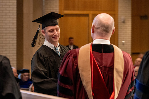 Students graduate from the College of Language and Letters, in the Taylor Building.