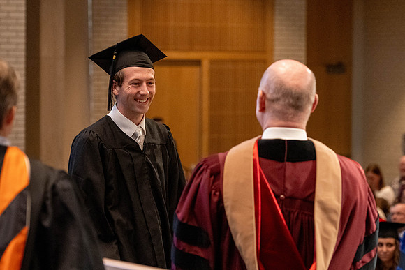Students graduate from the College of Language and Letters, in the Taylor Building.