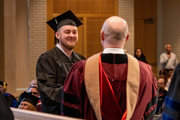 Students graduate from the College of Language and Letters, in the Taylor Building.