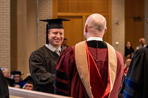 Students graduate from the College of Language and Letters, in the Taylor Building.