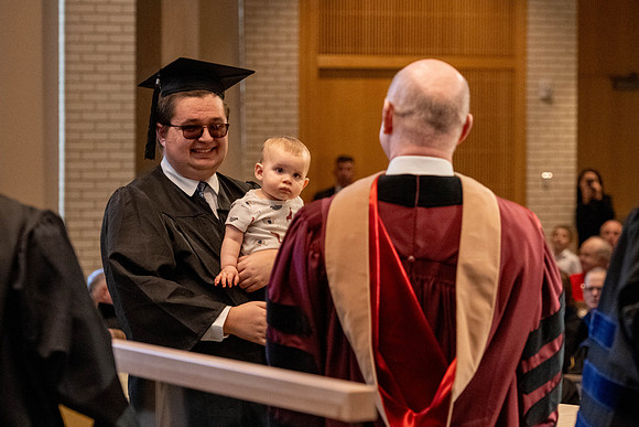 Students graduate from the College of Language and Letters, in the Taylor Building.