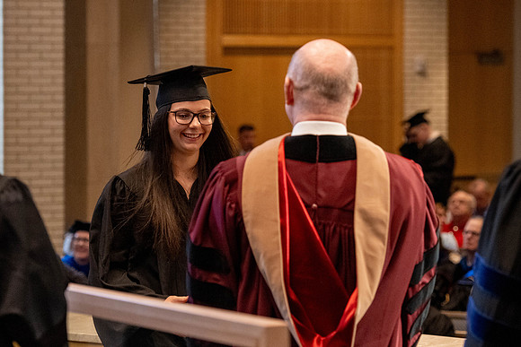 Students graduate from the College of Language and Letters, in the Taylor Building.