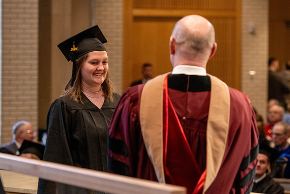 Students graduate from the College of Language and Letters, in the Taylor Building.