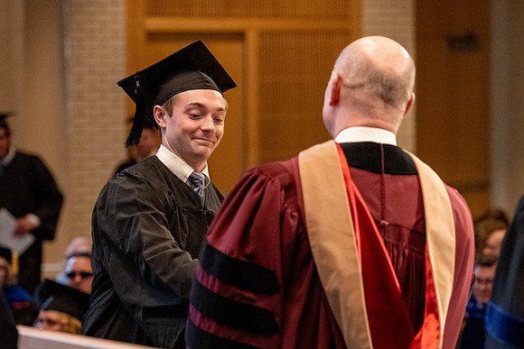Students graduate from the College of Language and Letters, in the Taylor Building.