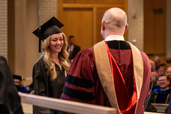 Students graduate from the College of Language and Letters, in the Taylor Building.