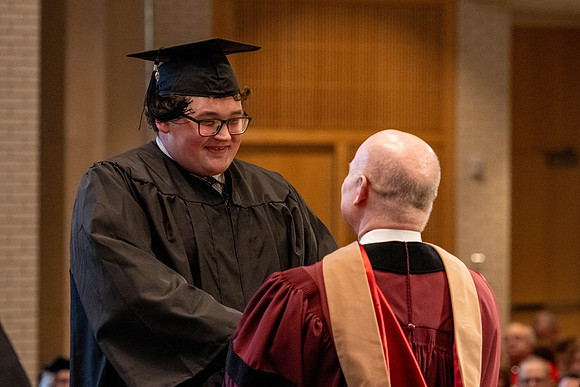 Students graduate from the College of Language and Letters, in the Taylor Building.