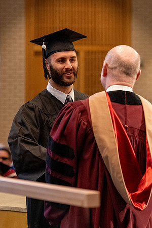 Students graduate from the College of Language and Letters, in the Taylor Building.