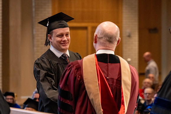 Students graduate from the College of Language and Letters, in the Taylor Building.