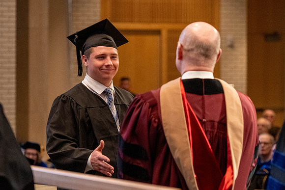 Students graduate from the College of Language and Letters, in the Taylor Building.
