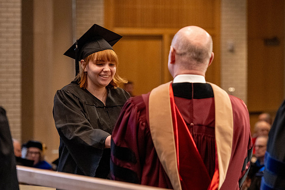Students graduate from the College of Language and Letters, in the Taylor Building.