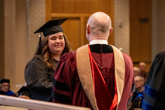 Students graduate from the College of Language and Letters, in the Taylor Building.