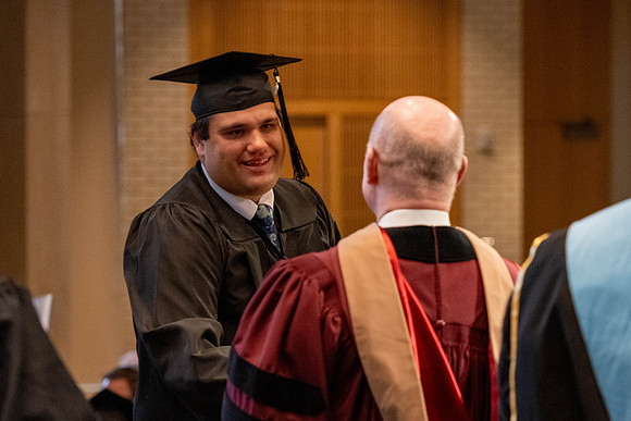 Students graduate from the College of Language and Letters, in the Taylor Building.