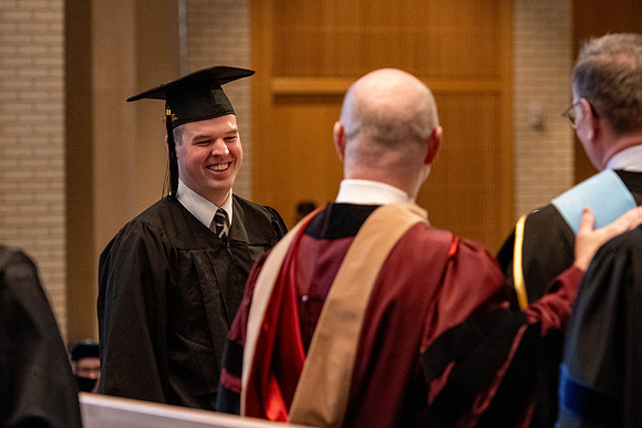 Students graduate from the College of Language and Letters, in the Taylor Building.
