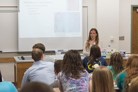 Sister Christensen picks on a student who raised his questioning head during the Essentials of Human Nutrition class in the 2014 Spring Semester.