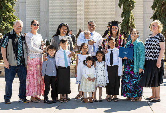Graduates outside the Taylor Building