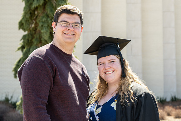 Graduates outside the Taylor Building