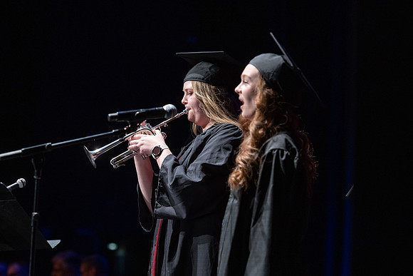Clara Cranney and Whitney Corpany perform for the Performing and Visual Arts convocation.