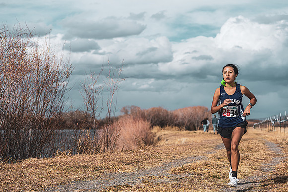 Students compete in the Competitive Sports Cross Country championship on a course at the BYU-Idaho Livestock Center.