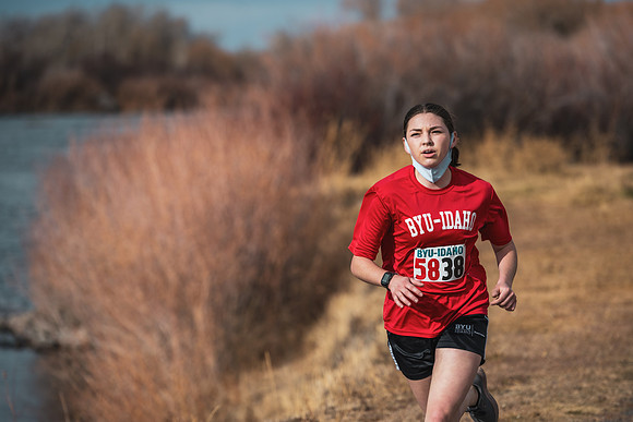 Students compete in the Competitive Sports Cross Country championship on a course at the BYU-Idaho Livestock Center.