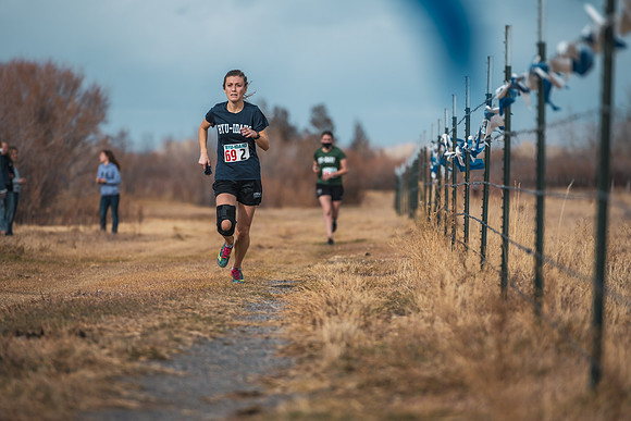 Students compete in the Competitive Sports Cross Country championship on a course at the BYU-Idaho Livestock Center.