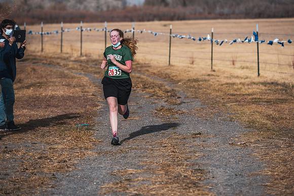 Students compete in the Competitive Sports Cross Country championship on a course at the BYU-Idaho Livestock Center.