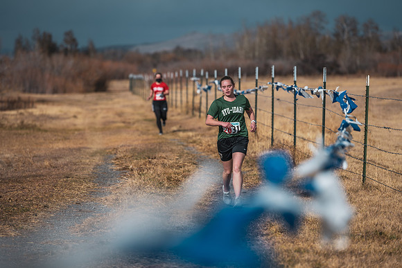 Students compete in the Competitive Sports Cross Country championship on a course at the BYU-Idaho Livestock Center.