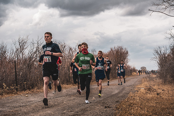 Students compete in the Competitive Sports Cross Country championship on a course at the BYU-Idaho Livestock Center.