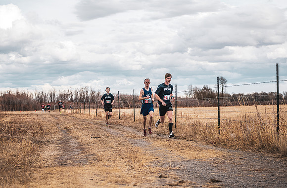 Students compete in the Competitive Sports Cross Country championship on a course at the BYU-Idaho Livestock Center.