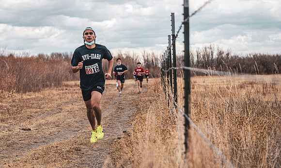 Students compete in the Competitive Sports Cross Country championship on a course at the BYU-Idaho Livestock Center.