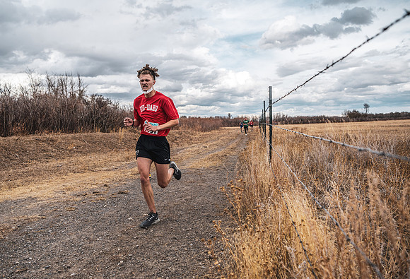 Students compete in the Competitive Sports Cross Country championship on a course at the BYU-Idaho Livestock Center.