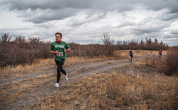 Students compete in the Competitive Sports Cross Country championship on a course at the BYU-Idaho Livestock Center.