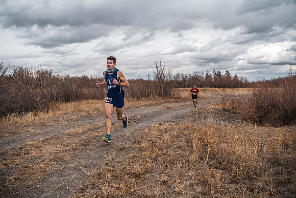 Students compete in the Competitive Sports Cross Country championship on a course at the BYU-Idaho Livestock Center.