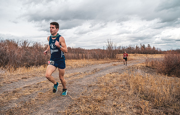 Students compete in the Competitive Sports Cross Country championship on a course at the BYU-Idaho Livestock Center.