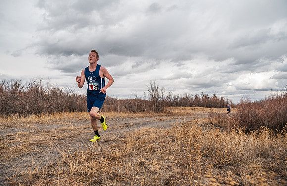 Students compete in the Competitive Sports Cross Country championship on a course at the BYU-Idaho Livestock Center.