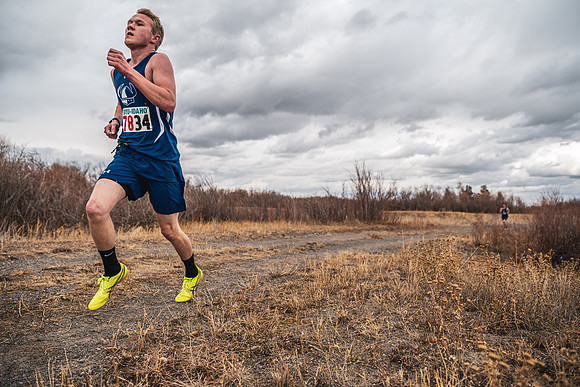 Students compete in the Competitive Sports Cross Country championship on a course at the BYU-Idaho Livestock Center.