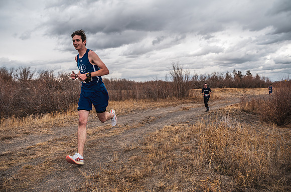 Students compete in the Competitive Sports Cross Country championship on a course at the BYU-Idaho Livestock Center.