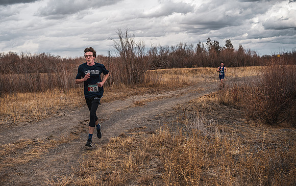 Students compete in the Competitive Sports Cross Country championship on a course at the BYU-Idaho Livestock Center.