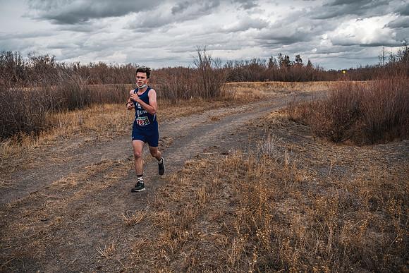 Students compete in the Competitive Sports Cross Country championship on a course at the BYU-Idaho Livestock Center.