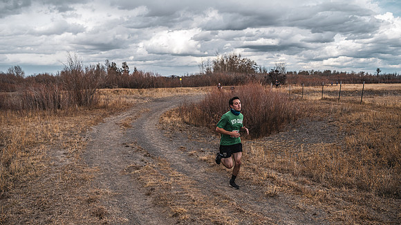 Students compete in the Competitive Sports Cross Country championship on a course at the BYU-Idaho Livestock Center.